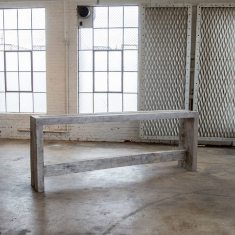 oak console in empty warehouse room